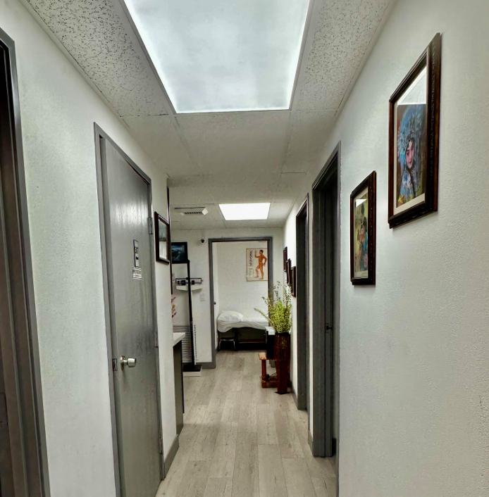 Bright hallway leading to private treatment rooms